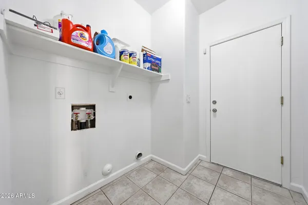 a utility room with shower and stairs