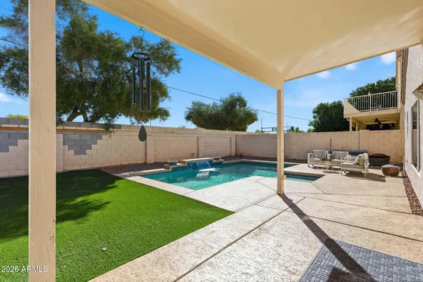a view of a backyard with sitting area