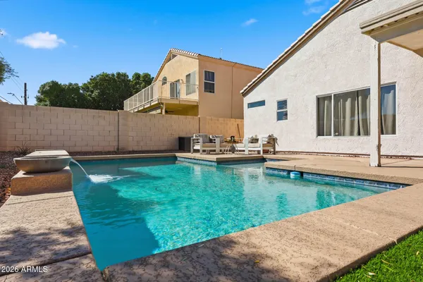 a view of a patio with swimming pool