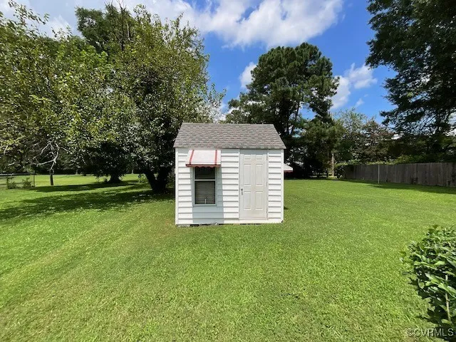 a backyard of a house with lots of green space