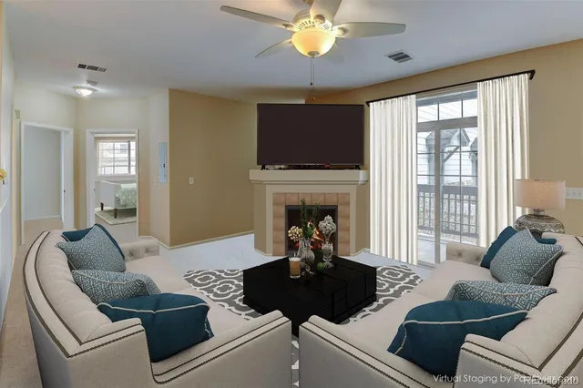 a living room with furniture and a fireplace