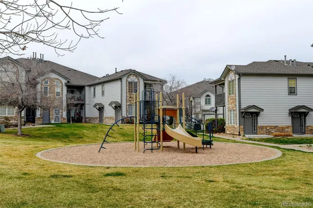 a swimming pool with outdoor seating and yard