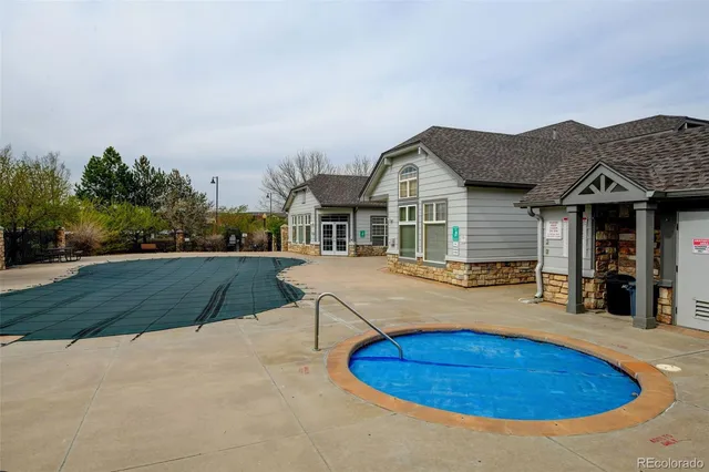 a living room with furniture large window and flat screen tv