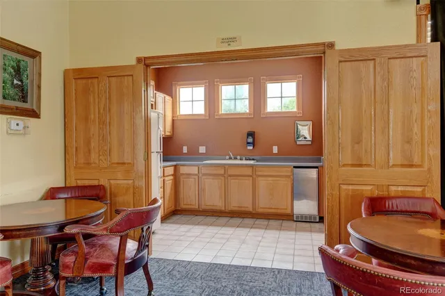 a view of entryway with wooden floor and windows