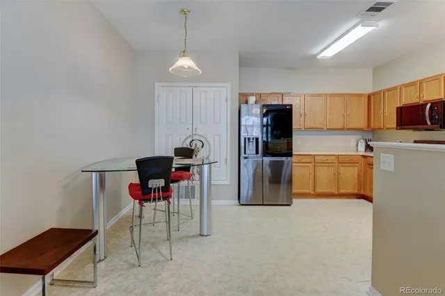 a kitchen with a refrigerator stove and microwave