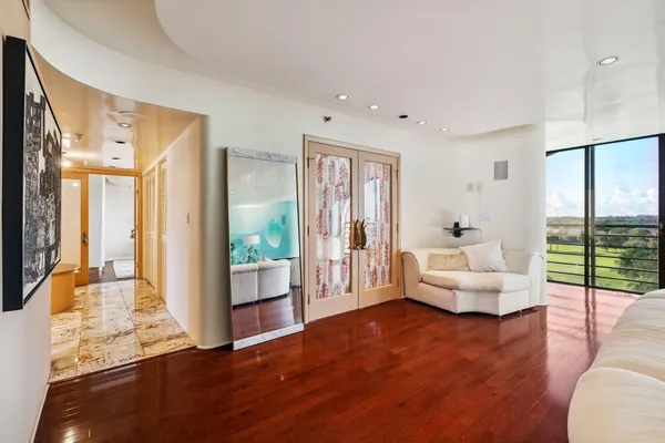 a living room with furniture and a large window