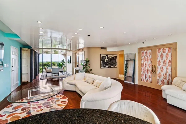 a living room with furniture or couch and a large window