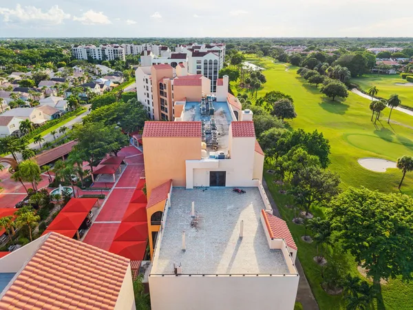 an aerial view of residential houses with outdoor space