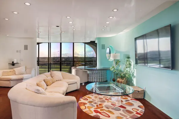 a living room with furniture and a large window