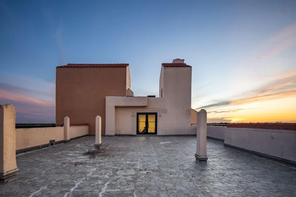 a view of an empty room with windows