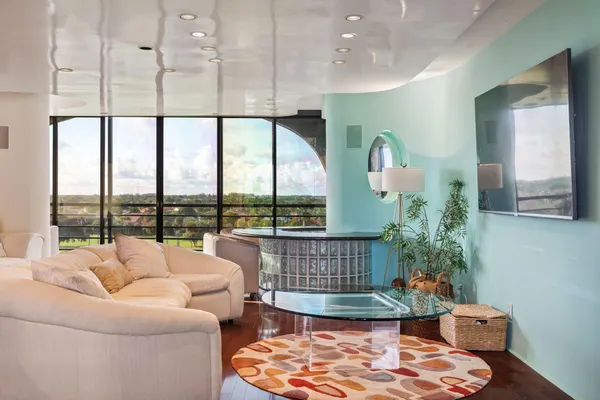 a living room with furniture and a large window