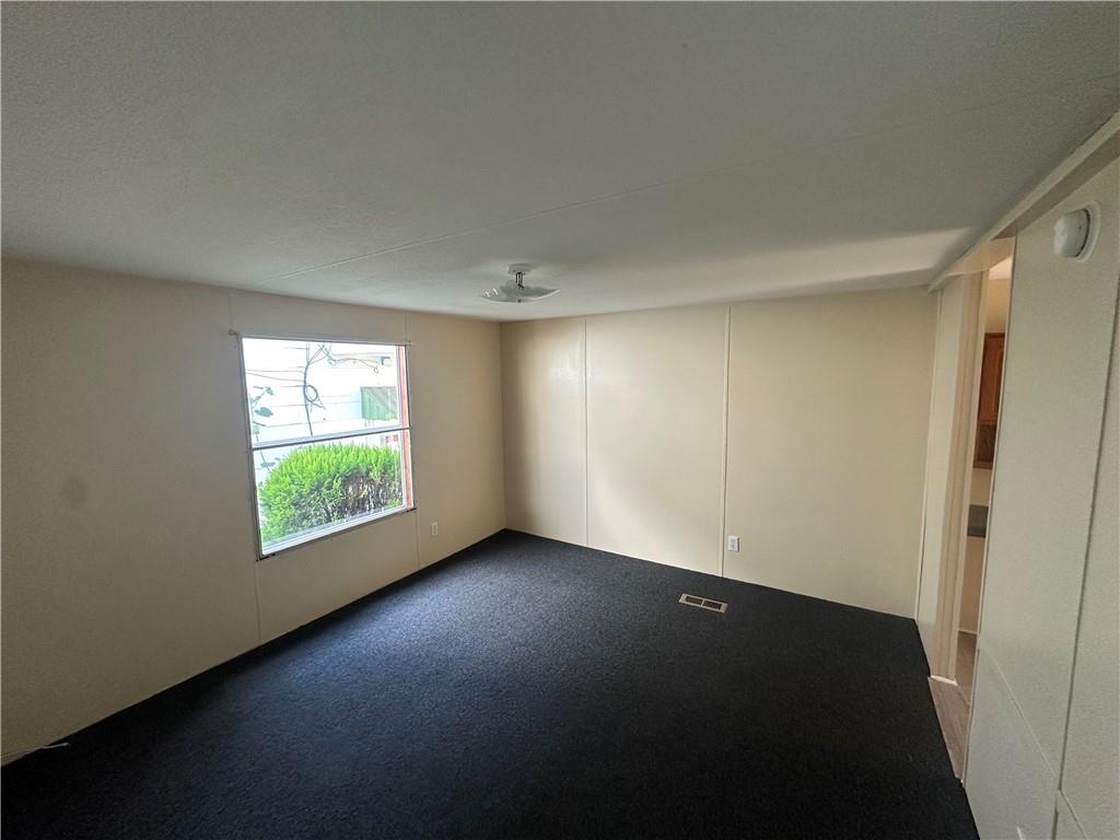 204-206 Cleveland Street Elco, PA 15434 - Photo 13 of 31 a view of an empty room with a window