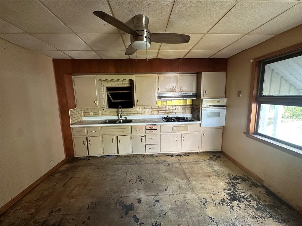 204-206 Cleveland Street Elco, PA 15434 - Photo 15 of 31 a kitchen with a stove a microwave and white cabinets