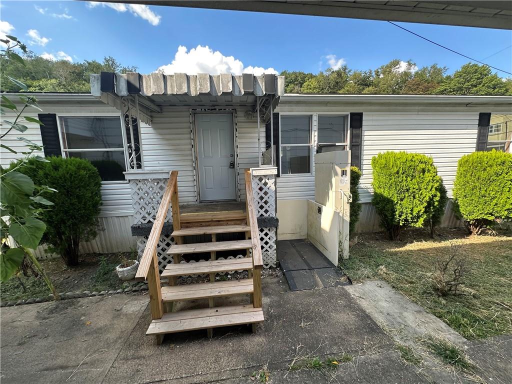 204-206 Cleveland Street Elco, PA 15434 - Photo 7 of 31 front view of a house with a yard