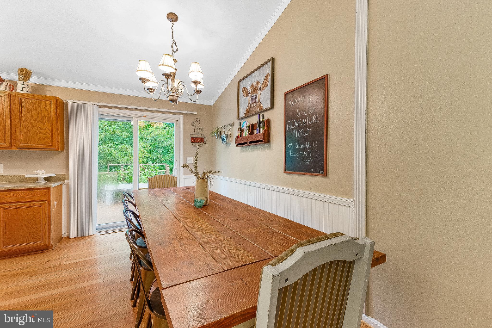 11356 Redlands Road Lusby, MD 20657 - Photo 4 of 36 a view of a dining room with furniture window and wooden floor