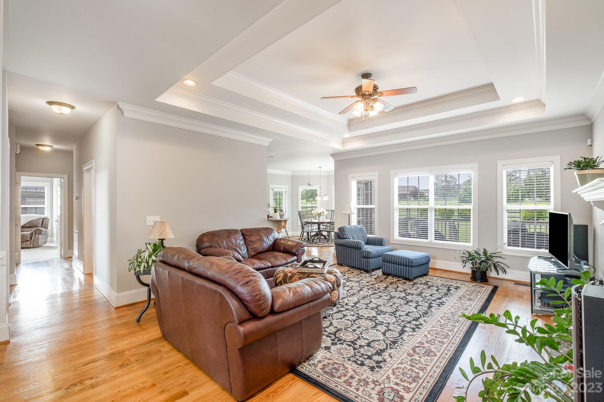 4733 Campobello Drive Monroe, NC 28110 - Photo 11 of 43 a living room with furniture ceiling fan and a rug