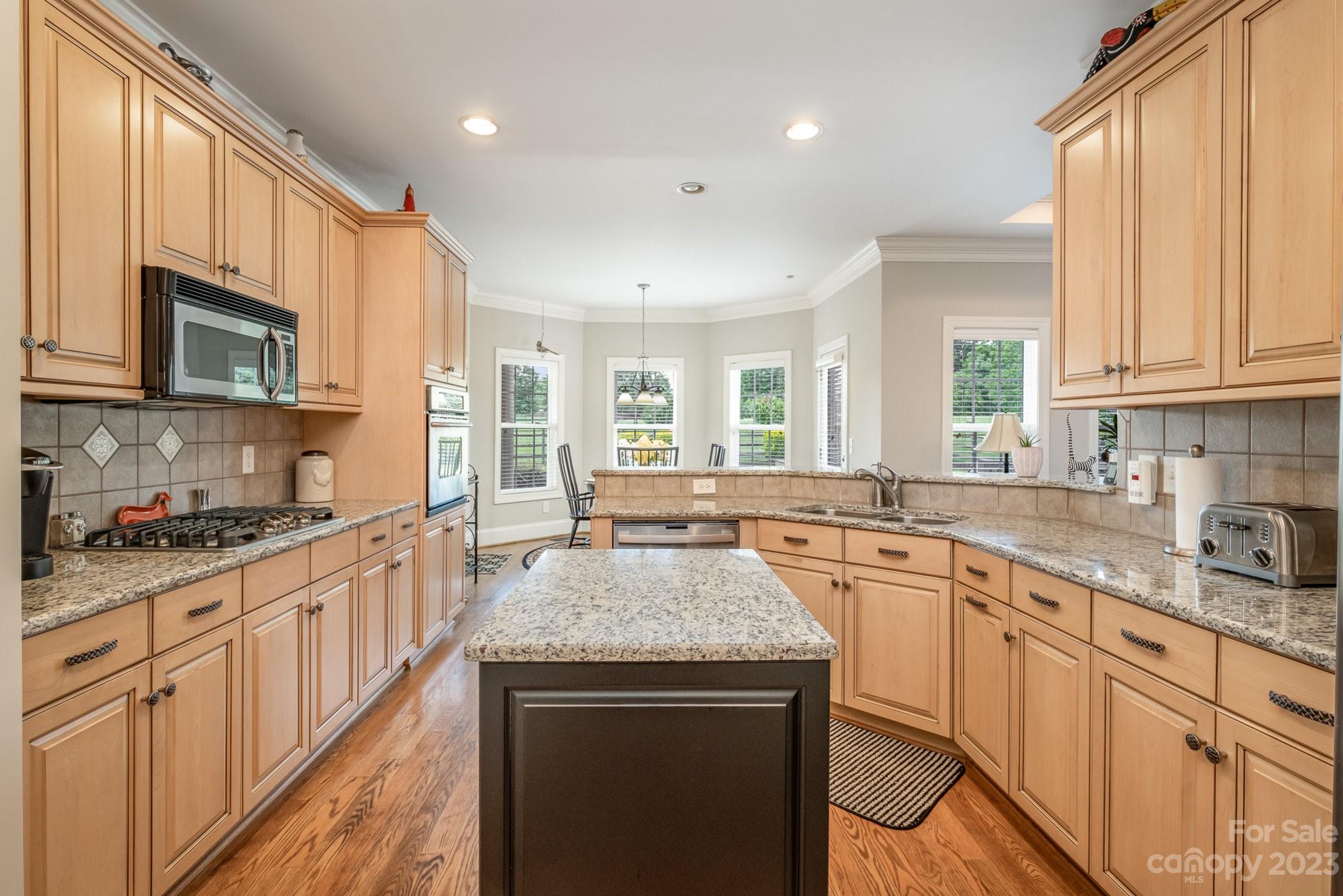 4733 Campobello Drive Monroe, NC 28110 - Photo 15 of 43 a kitchen with sink stove and cabinets
