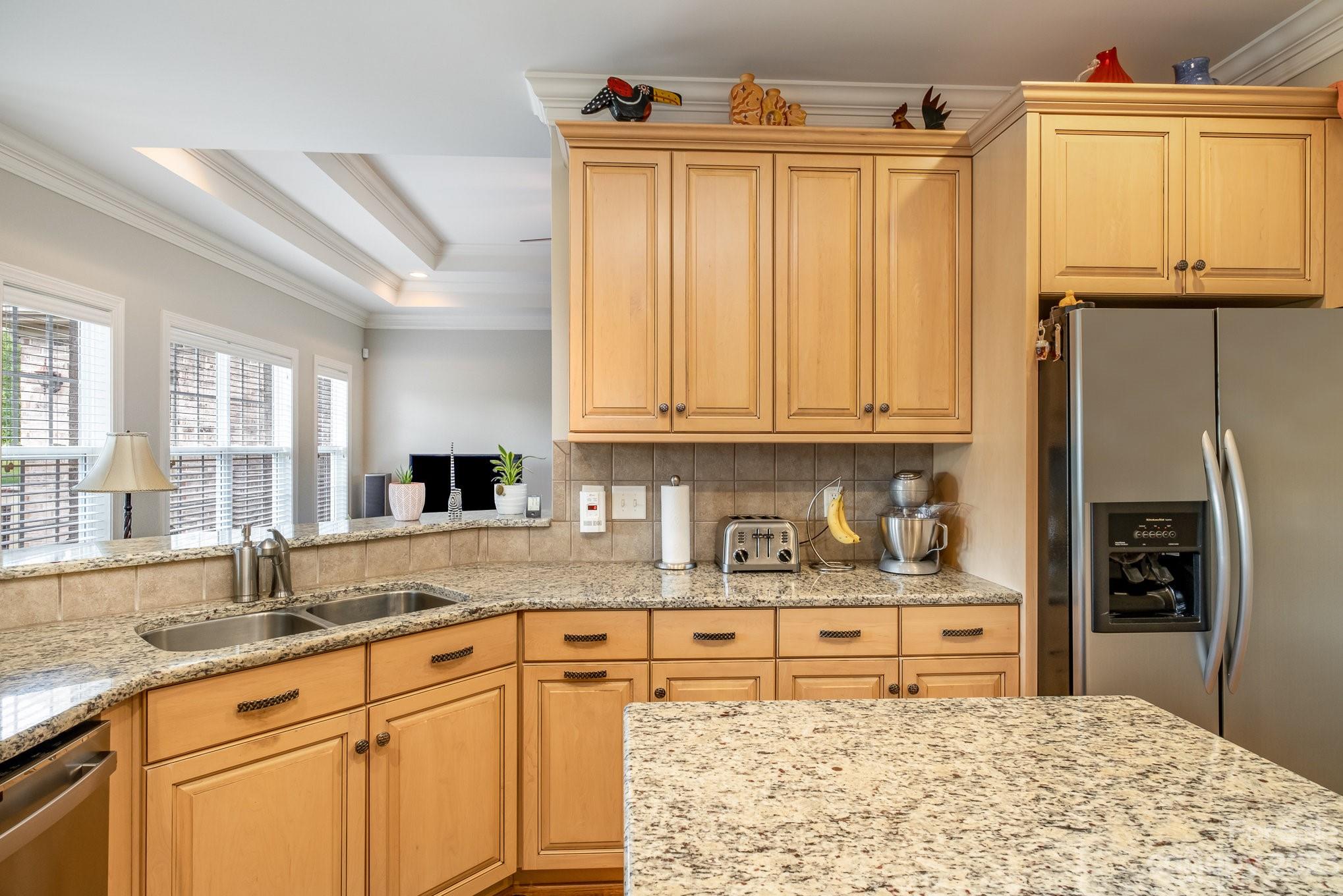 4733 Campobello Drive Monroe, NC 28110 - Photo 18 of 43 a kitchen with stainless steel appliances granite countertop a sink stove and cabinets