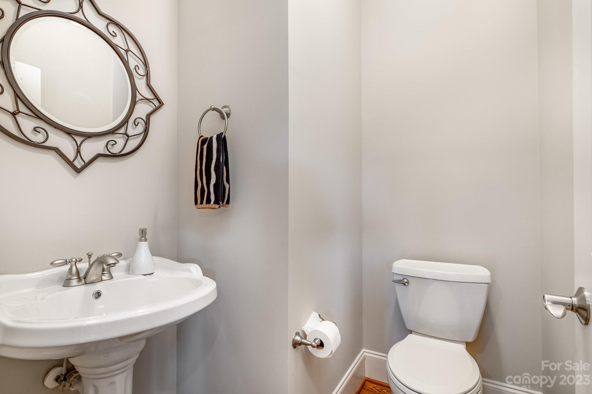 4733 Campobello Drive Monroe, NC 28110 - Photo 20 of 43 a bathroom with a toilet a sink and mirror