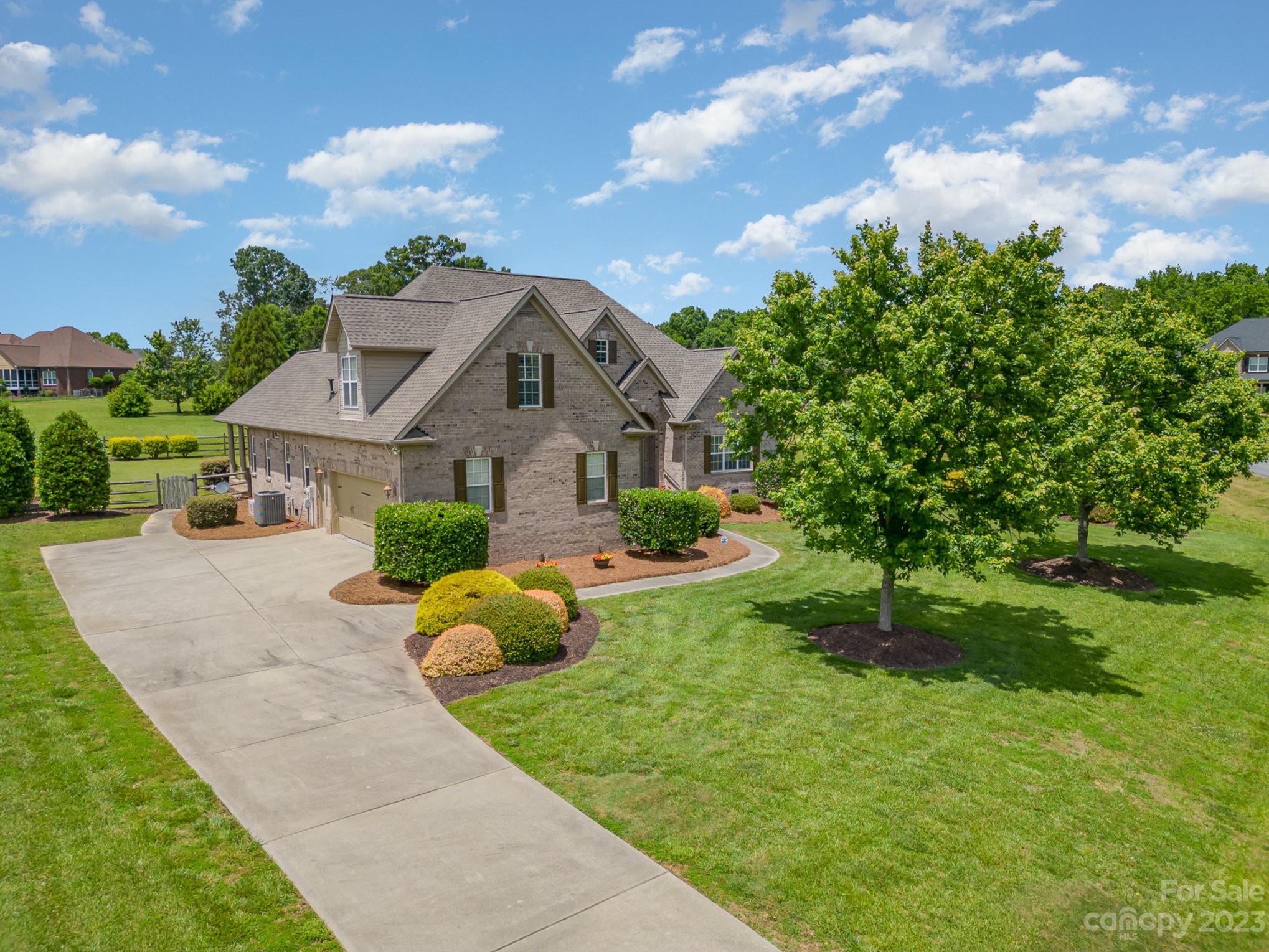 4733 Campobello Drive Monroe, NC 28110 - Photo 37 of 43 a front view of a house with garden