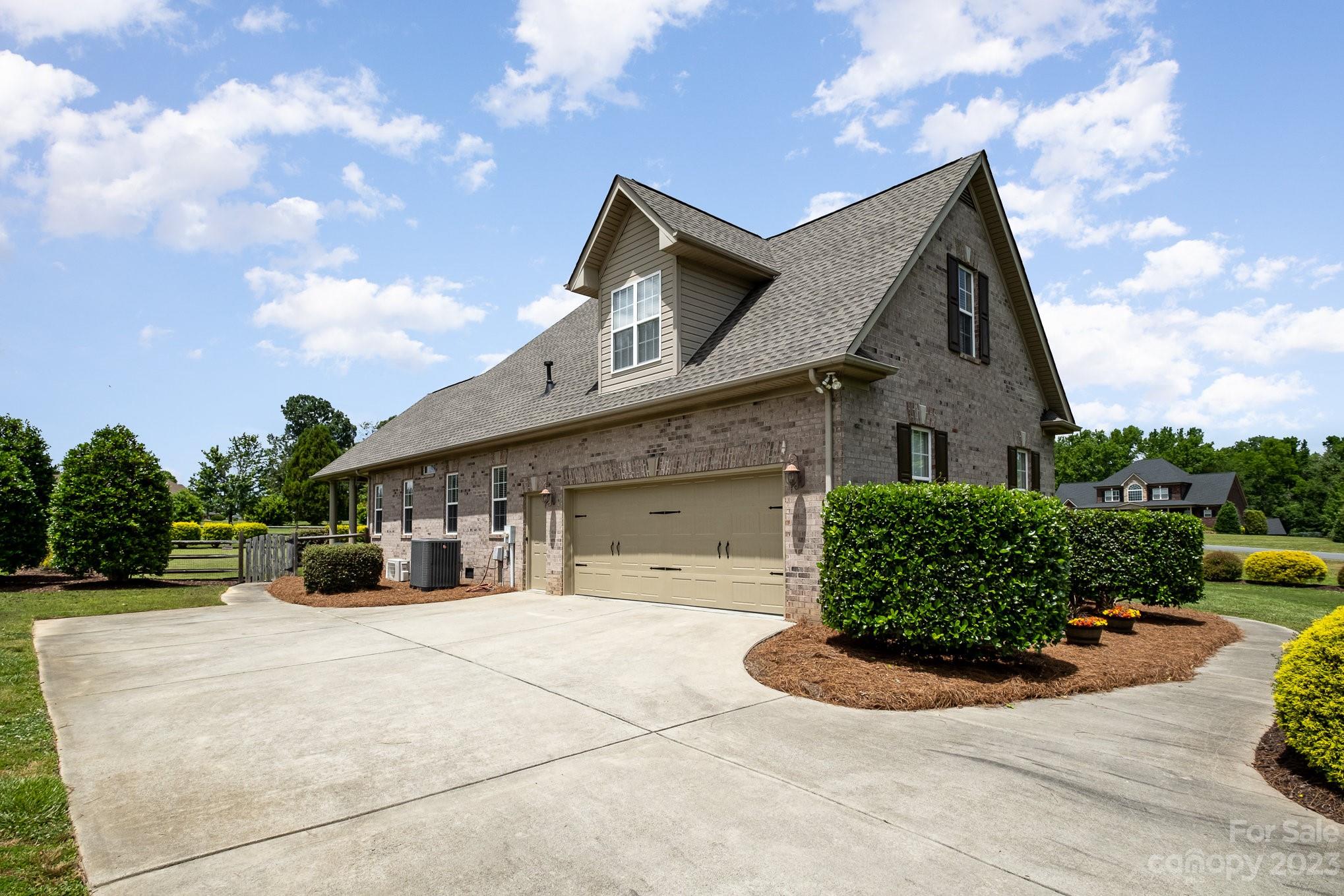 4733 Campobello Drive Monroe, NC 28110 - Photo 39 of 43 a front view of a house with a garden