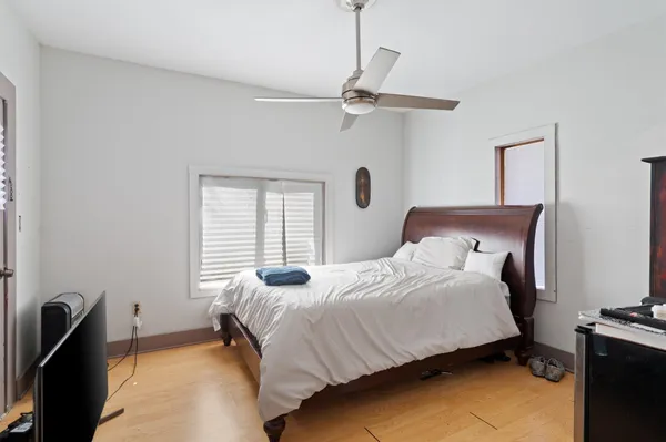 a bedroom with a bed and a dresser