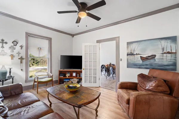 a living room with furniture and a flat screen tv