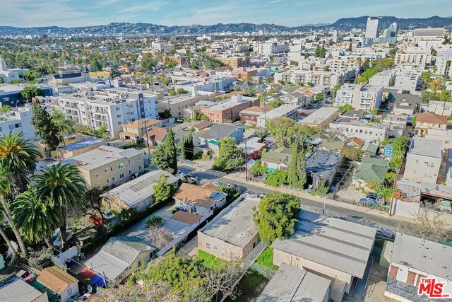 an aerial view of a house with a garden and plants