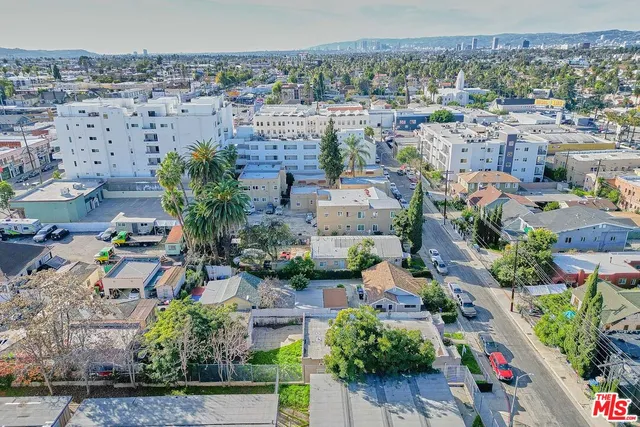 a aerial view of a house with a yard