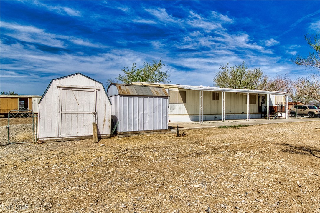 2631 Retread Road Pahrump, NV 89048 - Photo 2 of 18 View of shed with fence