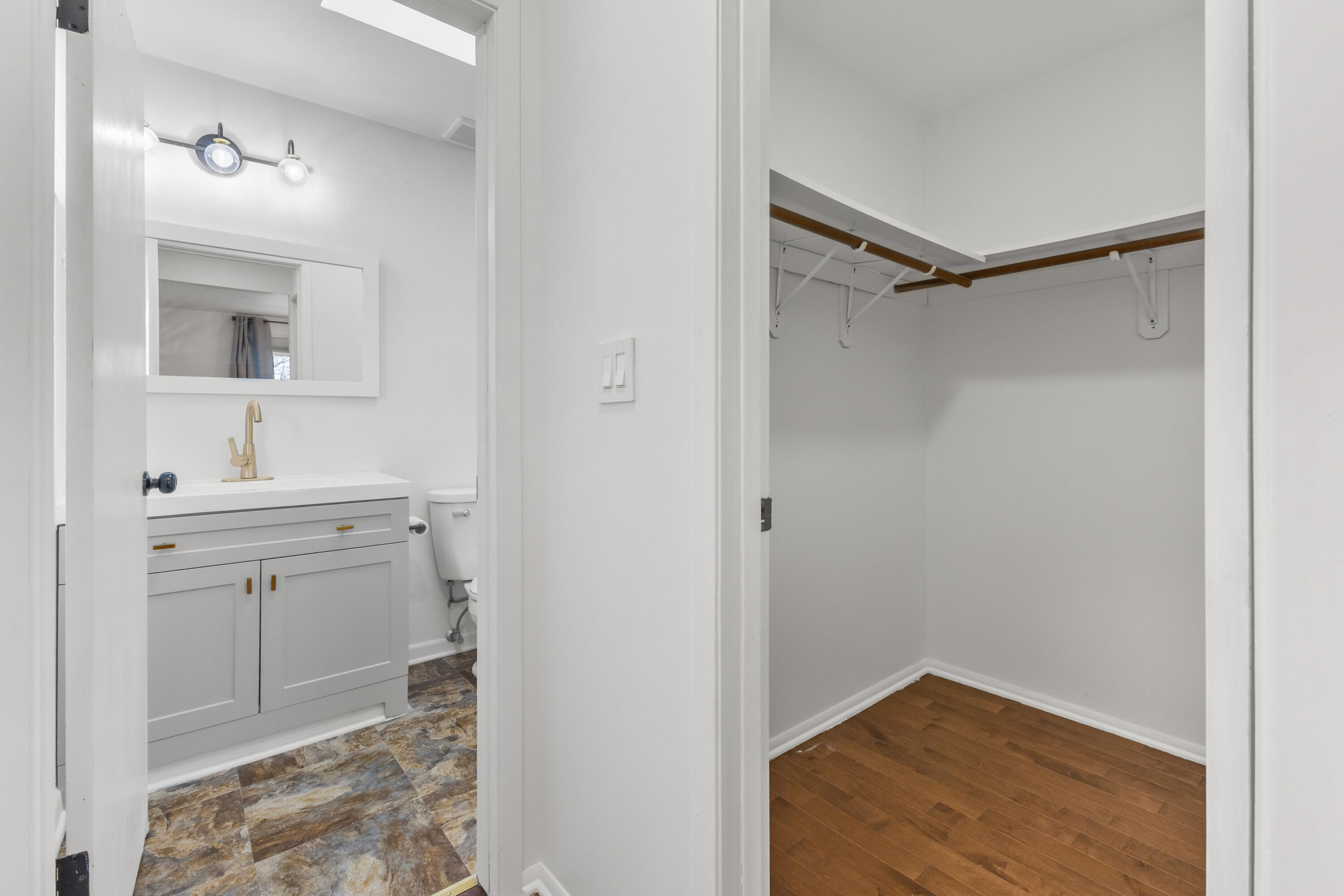 6609 Radburn Lane Greendale, WI 53129 - Photo 22 of 35 Master walk in closet and private bathroom