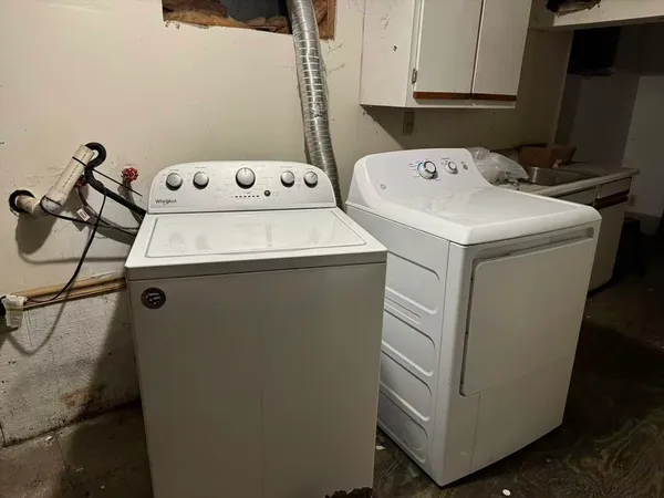 a utility room with dryer and washer
