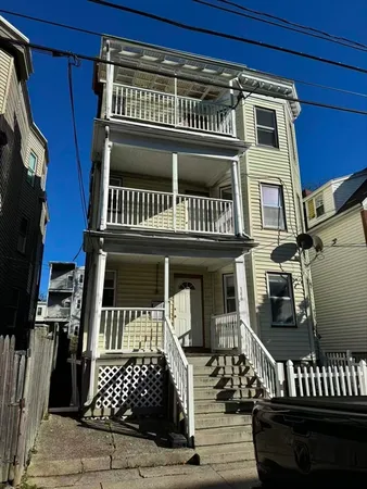 front view of a house with a balcony