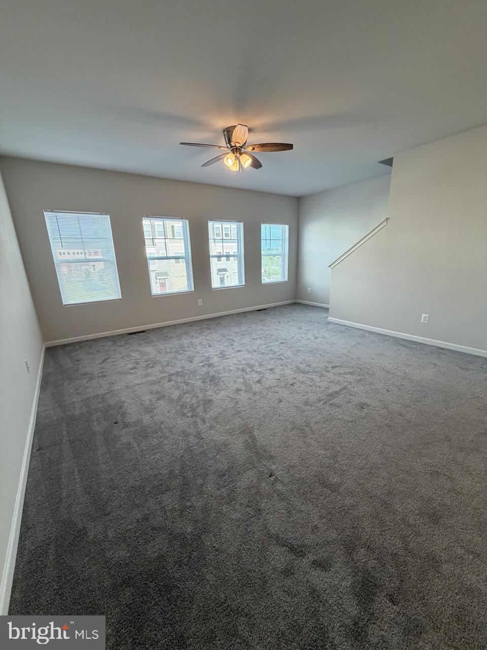 146 Galaxy Place Stephenson, VA 22656 - Photo 22 of 46 en empty room with windows and ceiling fan view