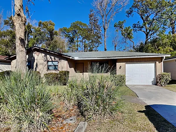front view of a house with a small yard