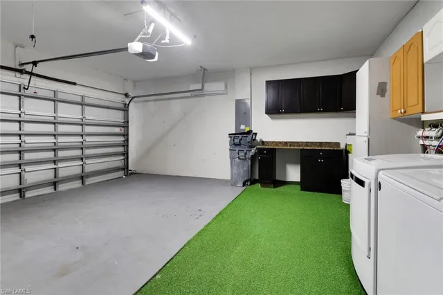 a view of a livingroom with furniture and a flat screen tv