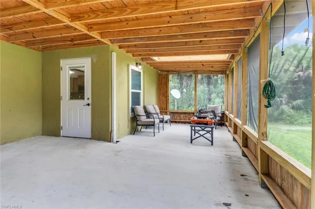a view of a room with outdoor seating