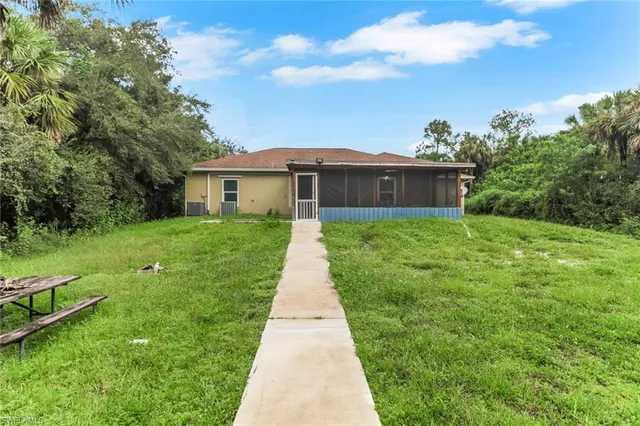 a front view of a house with yard