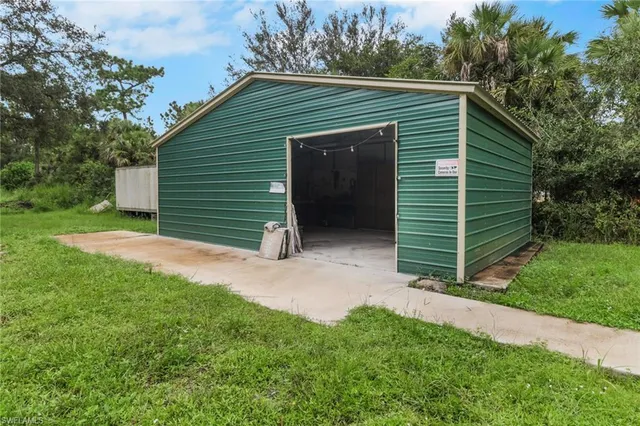 a view of a house with a yard and garage