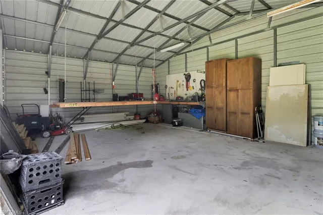 a room with lots of furniture and a chandelier