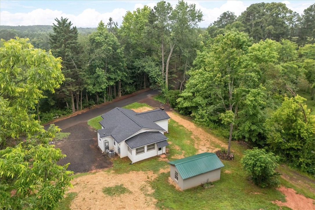 174 Holliday Road Six Mile, SC 29682 - Photo 49 of 49 A private, tree-lined road leads to this charming home and detached shed with room for a large garden, storage shed/workshop or large garage building