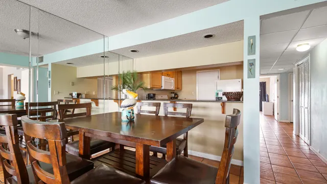 a kitchen with granite countertop a sink stainless steel appliances and a counter top space