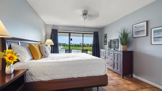 a bedroom with a bed and a night stand