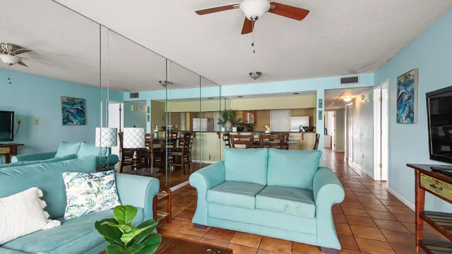 a dining room with a glass table and chairs