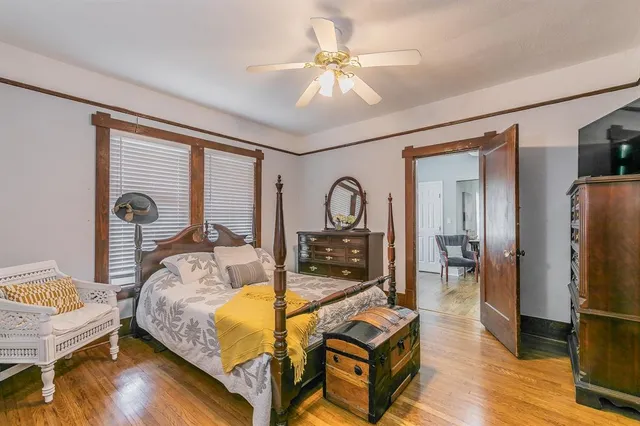 a bed room with a bed and a chandelier