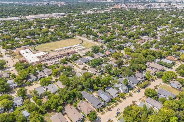 an aerial view of residential house with outdoor space and swimming pool