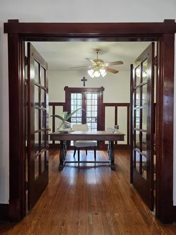 a view of a dining room with furniture window and wooden floor