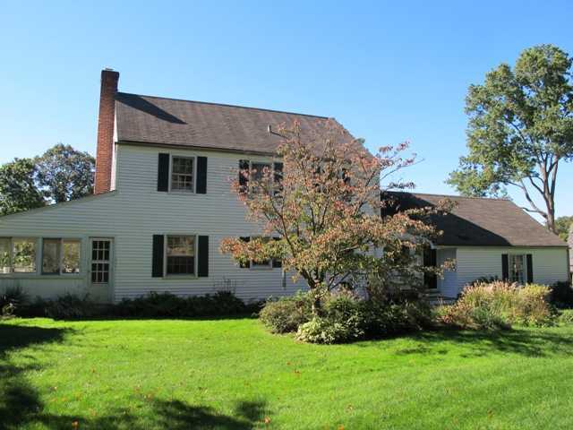 6 By Road Darien, CT 06820 - Photo 2 of 19 a front view of a house with a yard