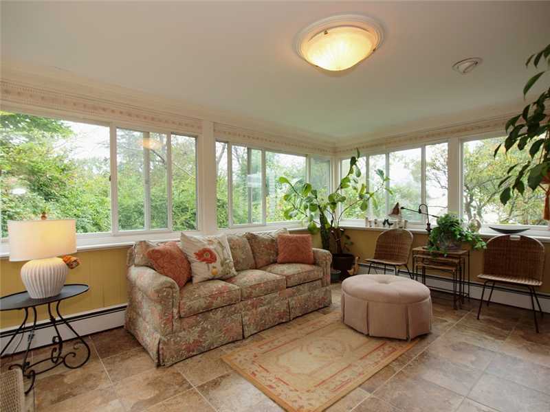 6 By Road Darien, CT 06820 - Photo 11 of 19 a living room with furniture and a large window