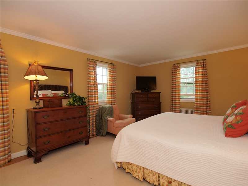 6 By Road Darien, CT 06820 - Photo 13 of 19 a bedroom with a bed and a dresser
